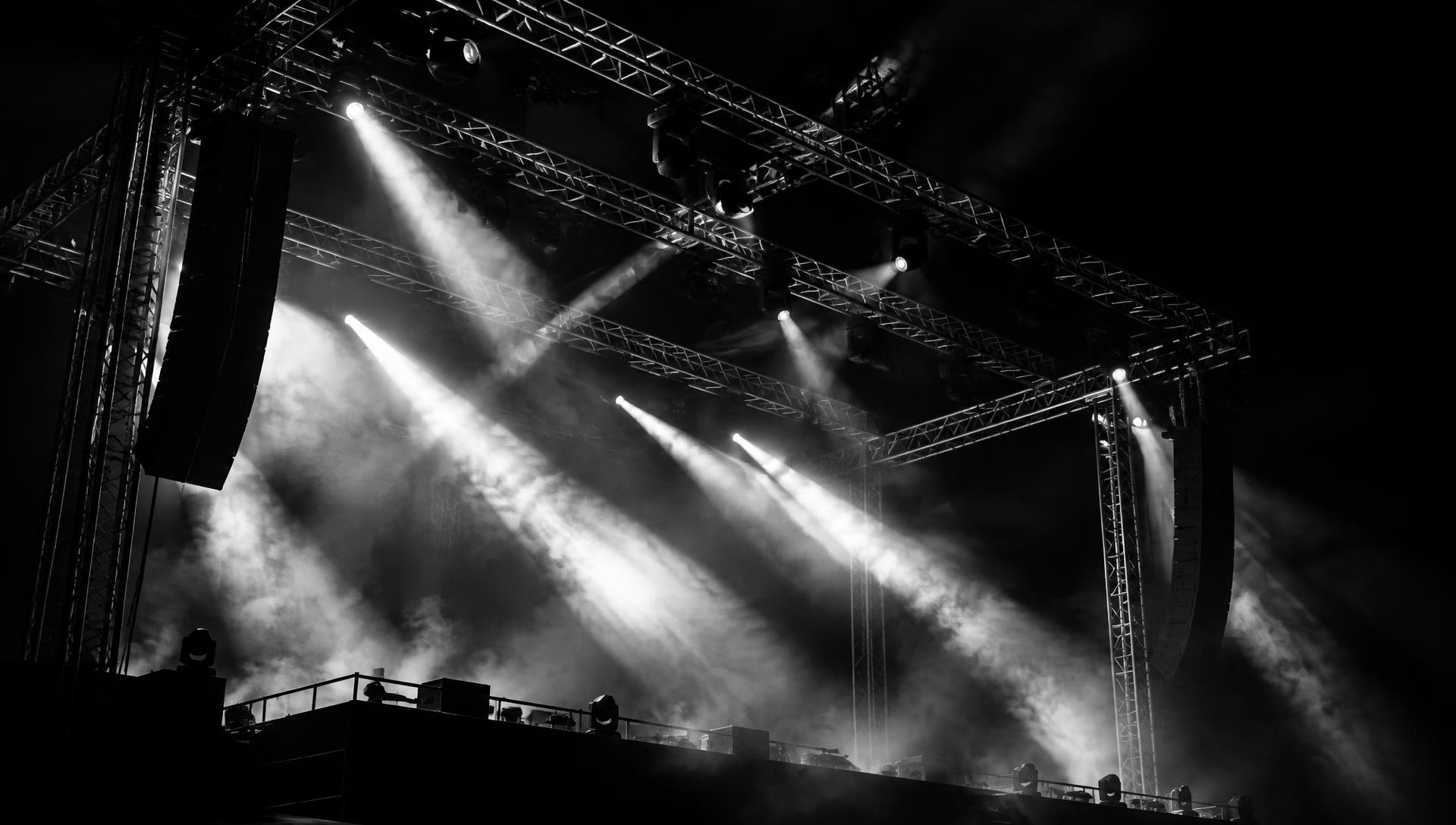 Concert stage lighting cutting through haze